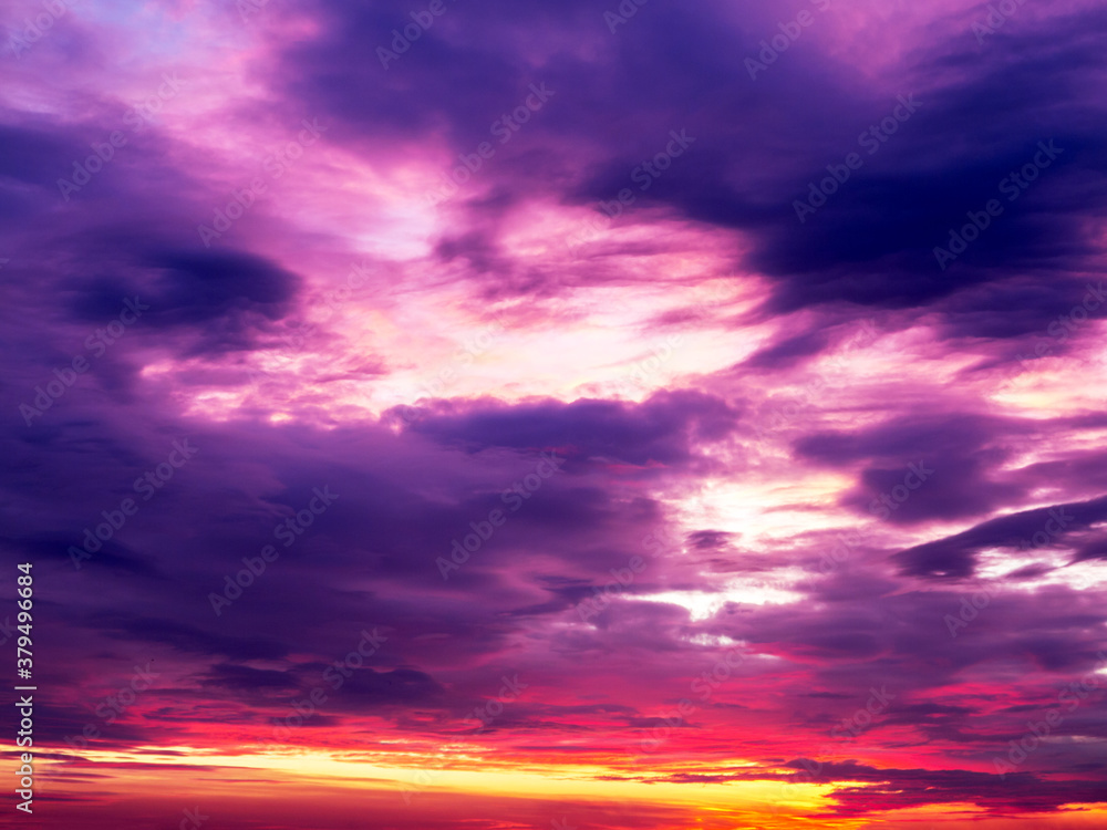 Fiery sunset sky. Beautiful sky. Evening sky with colorful cloud on twilight, Dusk. Background Sunset / sunrise with clouds, light rays and other atmospheric effect