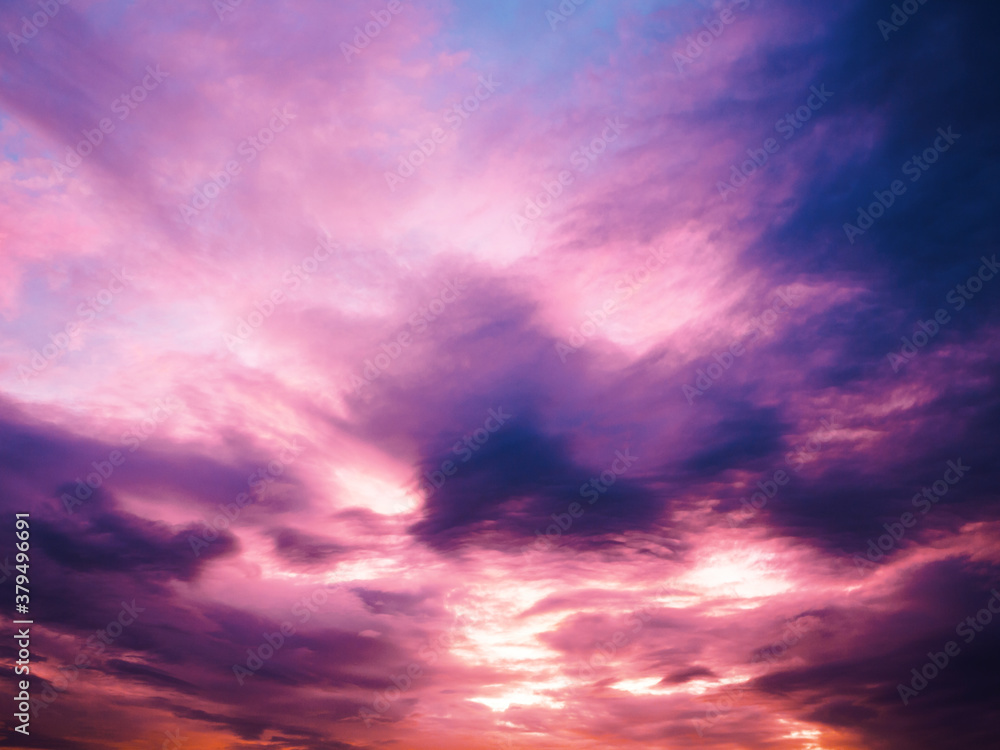 Fiery sunset sky. Beautiful sky. Evening sky with colorful cloud on twilight, Dusk. Background Sunset / sunrise with clouds, light rays and other atmospheric effect
