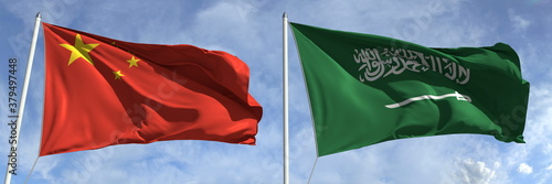 Flying flags of China and Saudi Arabia on sky background, 3d rendering