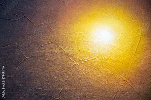 Abstract creative background of chaotic strokes of old cracked paint on concrete wall. Old surface with traces of paint, weathered, scratches and cracks for design