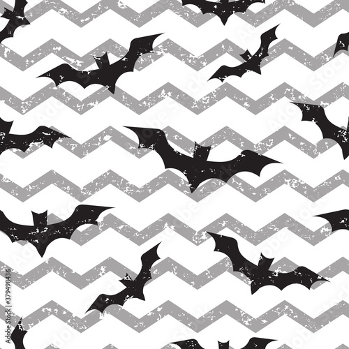 Halloween seamless pattern with bats on wave grunge print. Vector illustration