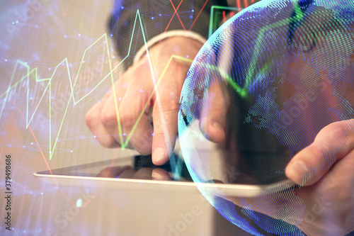 Multi exposure of man's hands holding and using a phone and financial chart drawing. Market analysis concept.