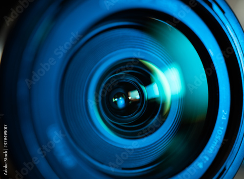 Macro close up of light shining through photographic lens