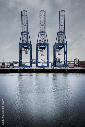 Row of three cranes on the Ipswich Dock on the River Orwell, Ipswich, Suffolk, England