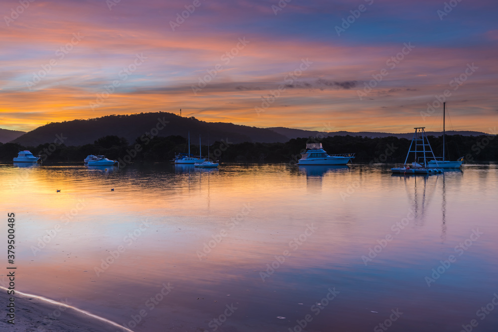 Sunset at the waterfront with high cloud and boats Sunset at the waterfront with high cloud and boats