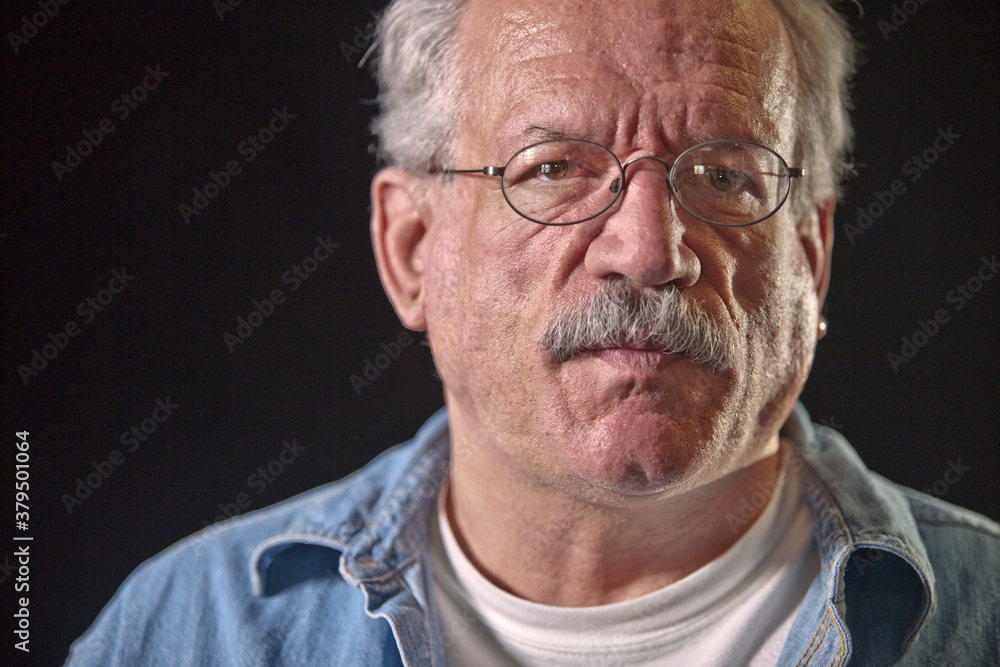 Serious older man wearing eyeglasses Serious older man wearing eyeglasses