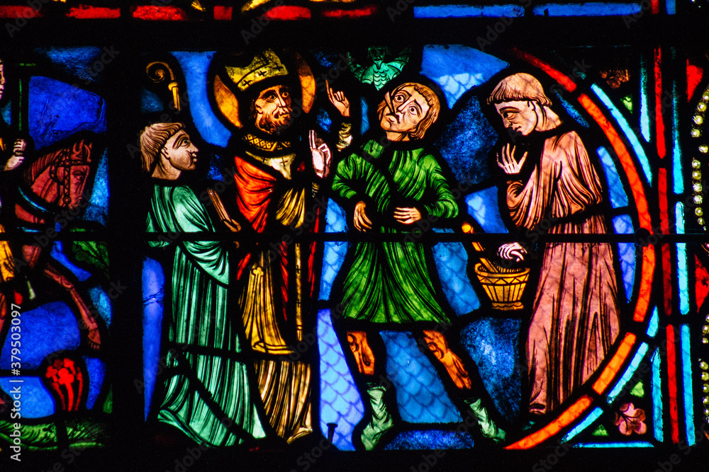 Fototapeta premium View of stained glass windows inside the Basilica of Saint-Remi, a medieval abbey church in Reims, a historical monument in the Grand Est region of France 