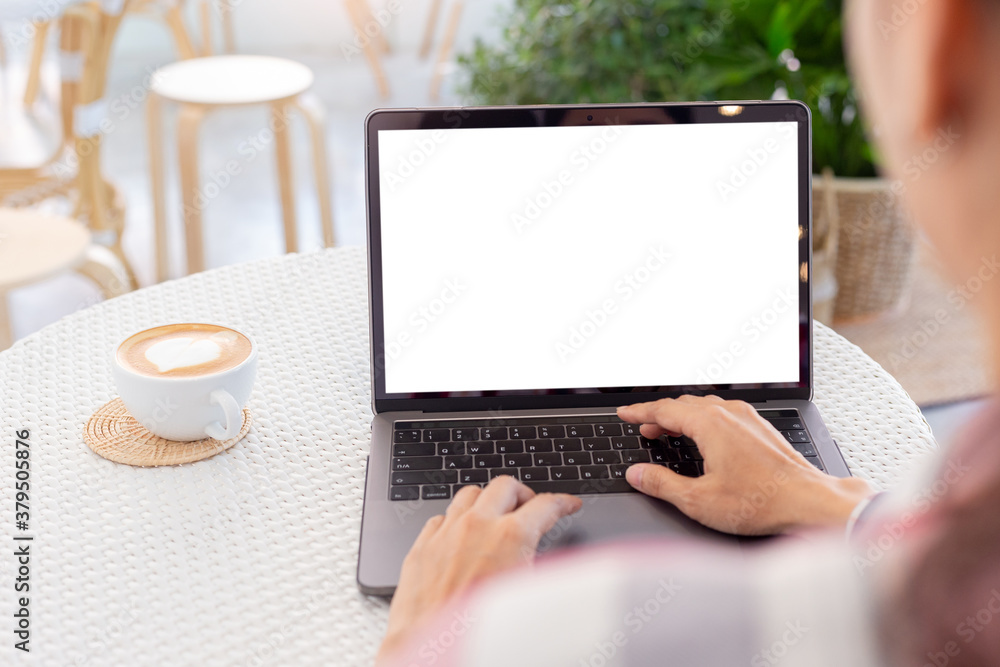 computer mockup blank screen.hand woman work using laptop with white background for advertising,contact business search information on desk at coffee shop.marketing and creative design computer mockup blank screen.hand woman work using laptop with white background for advertising,contact business search information on desk at coffee shop.marketing and creative design