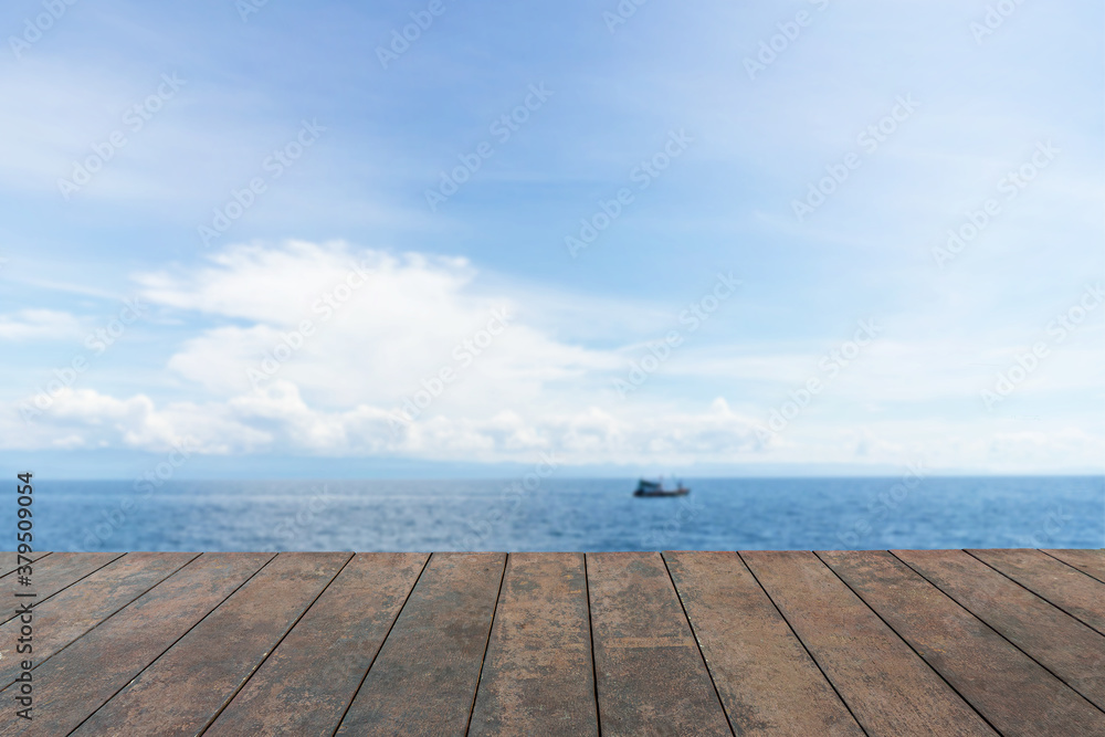 Wooden table top, Beauty seascape under blue clouds sky, blue sea background.