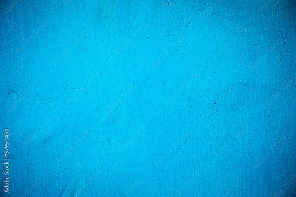 Blue paint painted on rough wall background