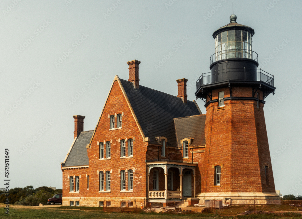 Block Island, RI / United States - Sept. 15, 2020: A landscape view of Block Island Southeast Light,  a lighthouse located on Mohegan Bluffs, designated a U.S. National Historic Landmark in 1997.