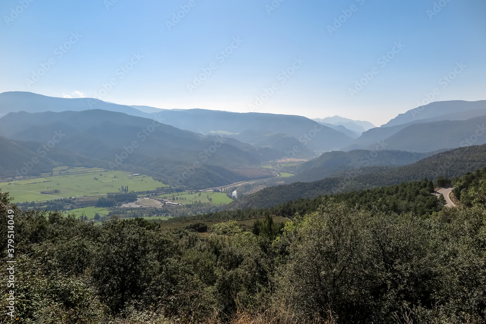 General view of valley with several mountains and forests, municipality of La Seu d'Urgell, in the region of Alt Urgell, Spain