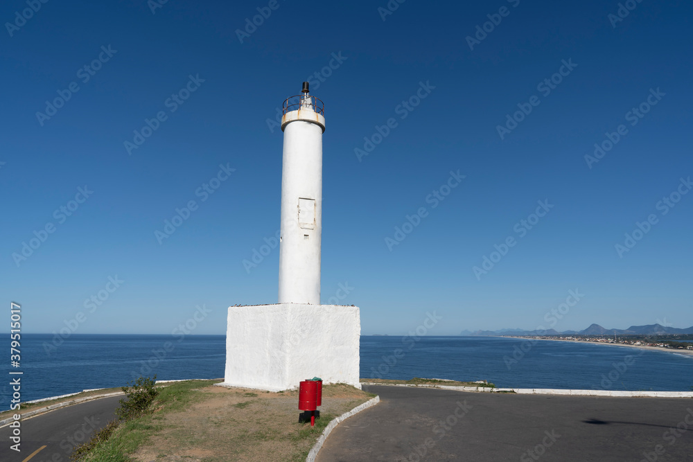 Beautiful view of the lighthouse and the sea. Ponta Negra Lighthouse. The city of Ponta Negra, State of Rio de Janeiro, Brazil. Beautiful view of the lighthouse and the sea. Ponta Negra Lighthouse. The city of Ponta Negra, State of Rio de Janeiro, Brazil.