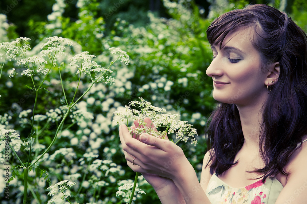young woman in the summer garden young woman in the summer garden