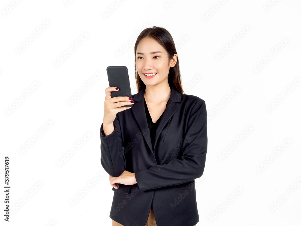 A young attractive Asian businesswoman in suit using smartphone. A young attractive Asian businesswoman in suit using smartphone.