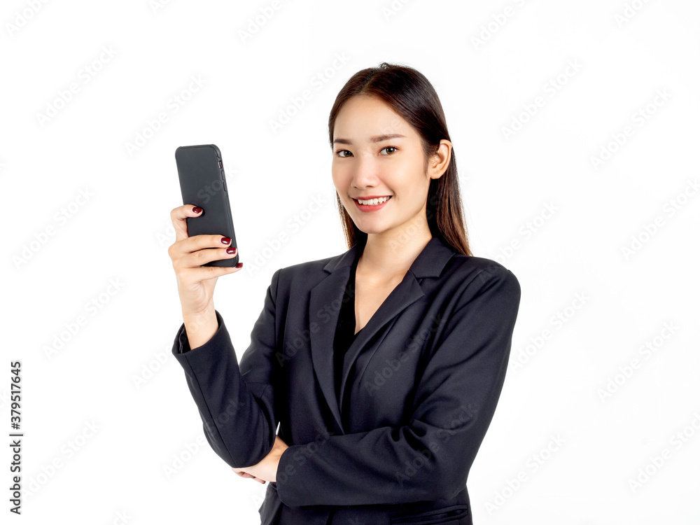 A young attractive Asian businesswoman in suit using smartphone. A young attractive Asian businesswoman in suit using smartphone.