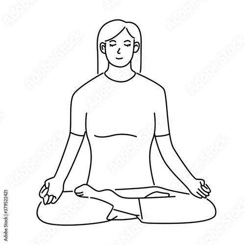 Young woman sitting cross legged on floor and meditating. Meditation, relaxation at home, spiritual practice, yoga and breathing exercise