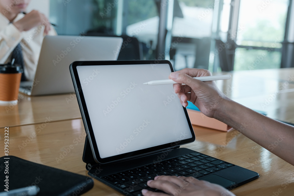 Close up hand of businesswoman with digital tablet with blank screen on wooden desk. Close up hand of businesswoman with digital tablet with blank screen on wooden desk.