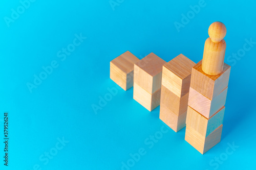 Toy wooden blocks on blue background front view