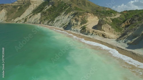 Amazing view of El Morro beach in Monte Cristi, with mountains in the background, warm blue waters photo
