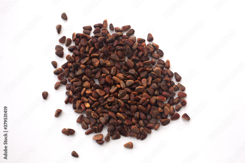 Heap of pine nuts on a white background. Heap of pine nuts on a white background.