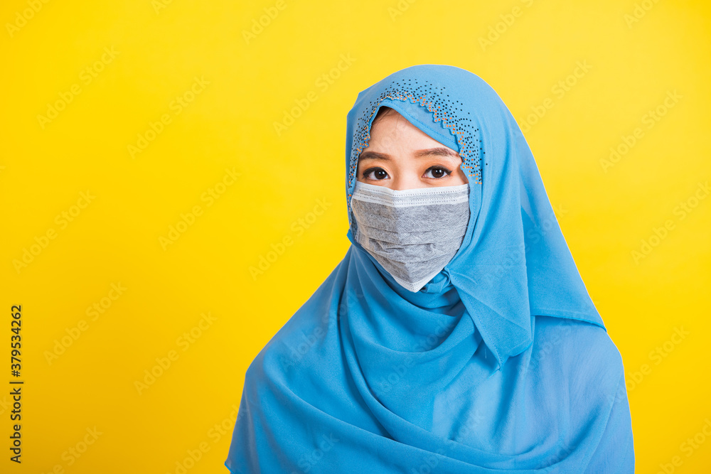 Asian Muslim Arab, Portrait of happy beautiful young woman religious wear veil hijab smiling studio shot isolated, yellow background with copy space, Close up skin face Asian Muslim Arab, Portrait of happy beautiful young woman religious wear veil hijab smiling studio shot isolated, yellow background with copy space, Close up skin face