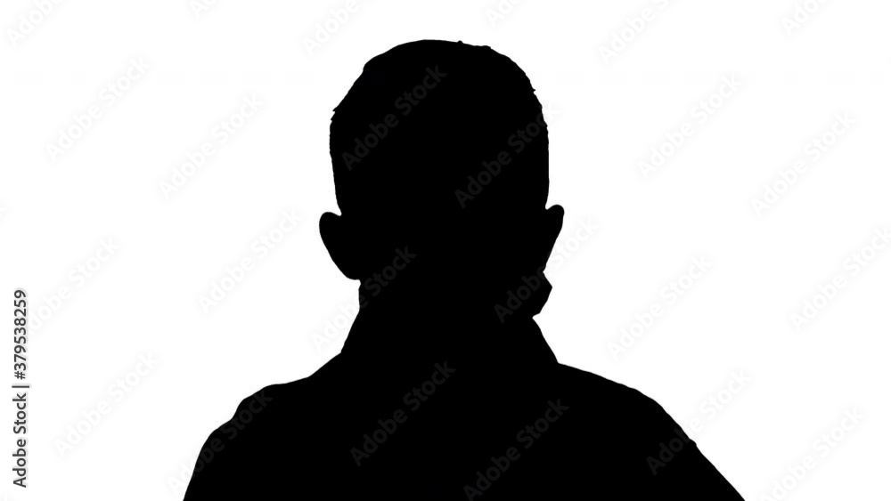 Silhouette Little boy adjusting his face mask looking at camera. Silhouette Little boy adjusting his face mask looking at camera.