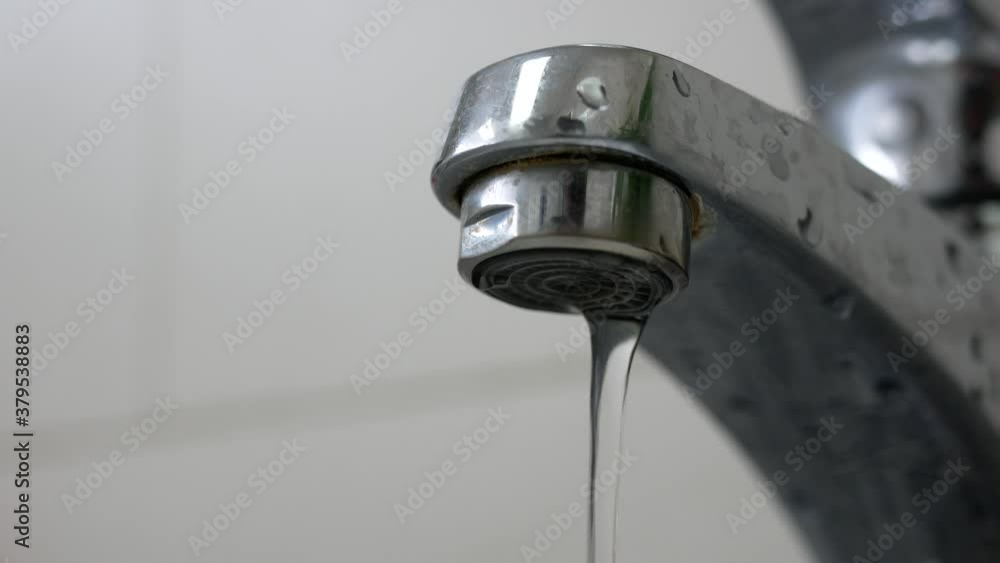 faucet and falling water in toilet. faucet and falling water in toilet.