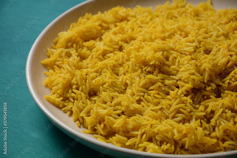 Yellow wild rice cooked with curcuma turmeric spice Yellow wild rice cooked with curcuma turmeric spice