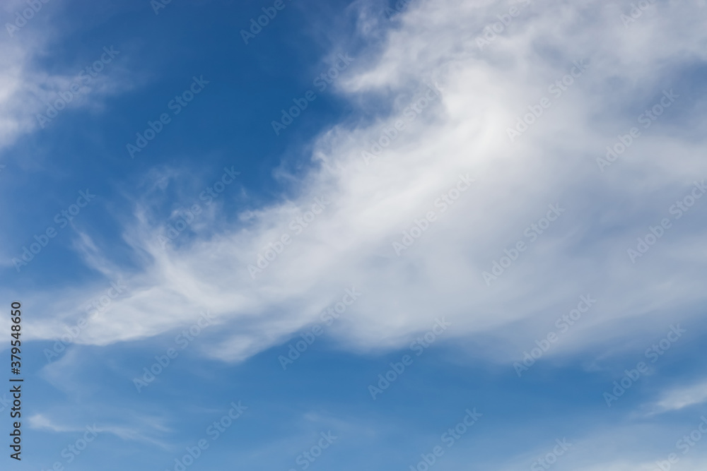 nature background., white clouds over blue sky soft focus.