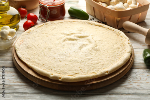 Ingredients for cooking pizza on wooden background