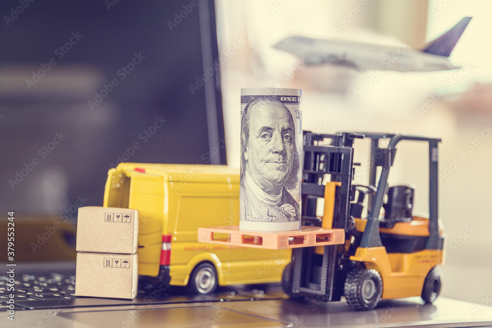 Security service for transporting of valuable asset, financial concept : Fork-lift truck, a roll of US USD dollar note, boxes, cash van or delivery van on a laptop, depicts transporting valuable stuff
