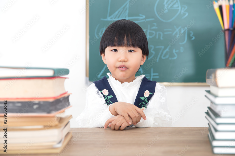 Chinese girl waiting to learn at the table Chinese girl waiting to learn at the table