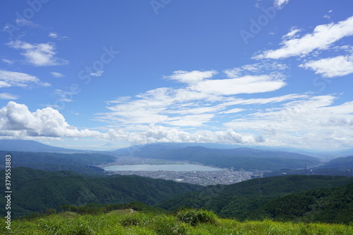 Fototapeta Naklejka Na Ścianę i Meble -  Lake Suwa and Mt. Fuji overlooking the Takabotchi plateau in fine weather