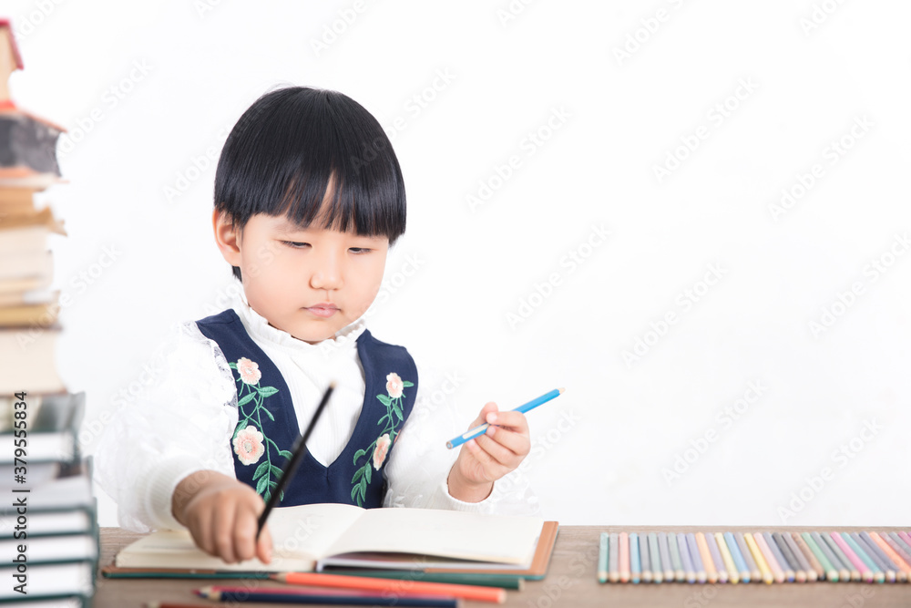 Four year old girl is studying Four year old girl is studying