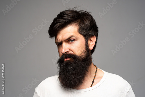 Portrait of confident serious man has beard and mustache. Businessman thinking with expression looking. Handsome male model, closeup face.