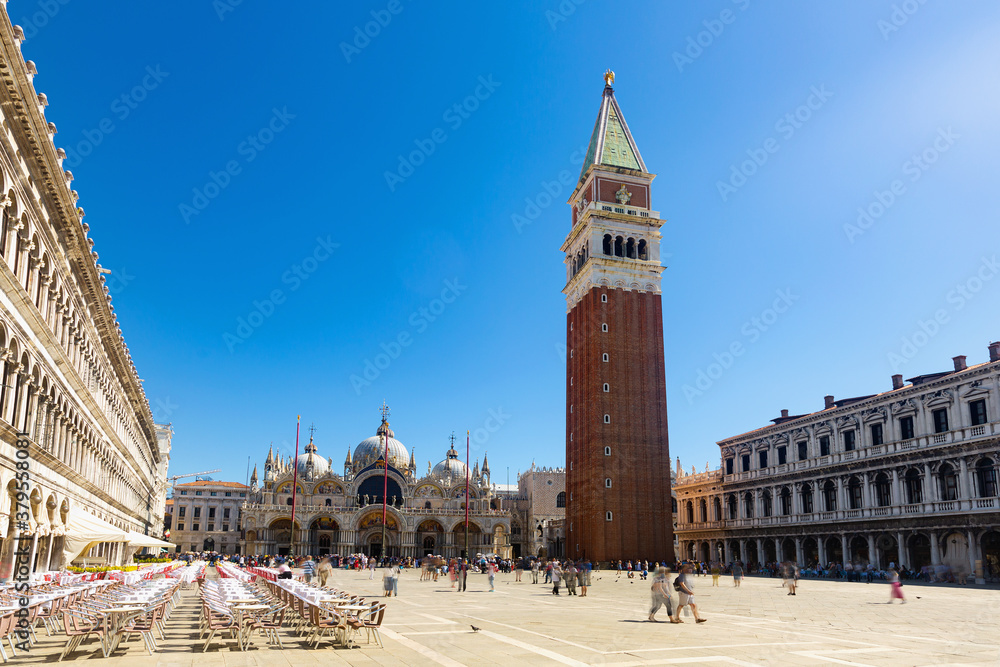 Scenic view of principal public square of Venice Piazza San Marco overlooking Basilica of Saint Mark and Campanile in sunny autumn day, Italy