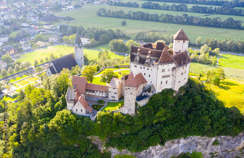 Φωτογραφία View from drone of stone Gutenberg Castle on top of green hill on background wit