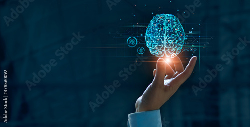 Hand touching brain of AI, Symbolic, Machine learning, artificial intelligence of futuristic technology. AI network of brain on business analysis, innovative and business growth development. photo
