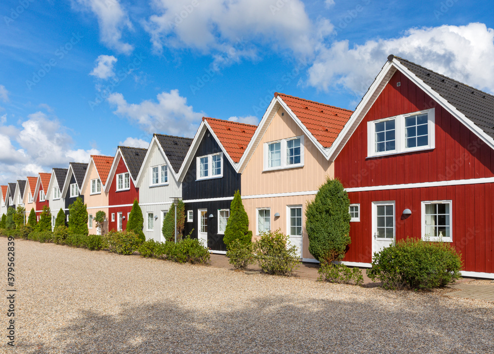Row of wooden holiday cottages in Denmark