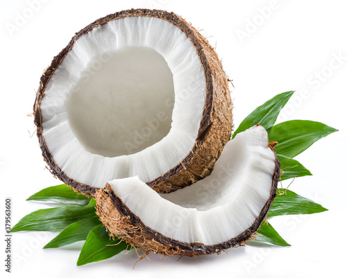 Cracked coconut fruit with white flesh and a piece of coconut isolated on white background.