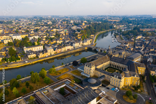 Flight over the city Chateau-Gontier Mayenne river on summer day. France