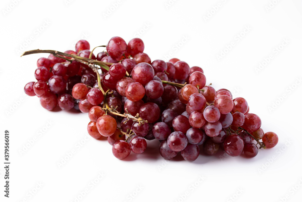 Red seedless grapes on a white background