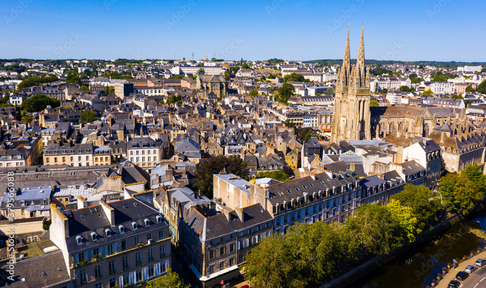 Drone view of summer cityscape of Quimper on Odet river with Gothic Roman Catholic cathedral, Brittany, France