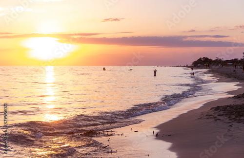 Summertime  beach sunset. Torre Mozza Beach  with its of coast with fine sand  is one of the longest and most appealing among those in the South part of Salento in Apulia  Italy.