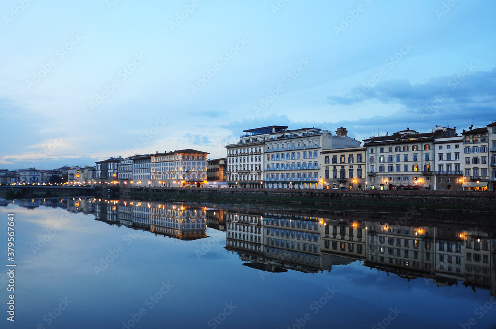 Evening view of townscape at the edges of the Arno river,  in Florence, Italy. Fiume Arno.