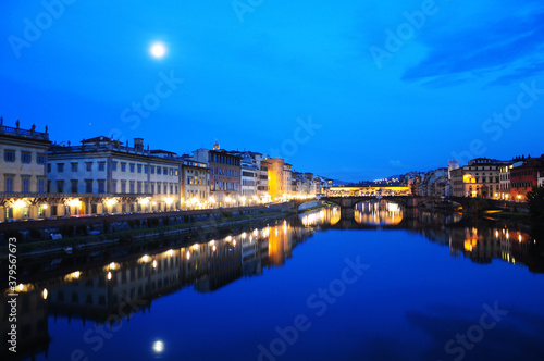 NIght view of townscape at the edges of the Arno river, in Florence, Italy. Fiume Arno.