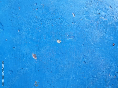 concrete wall painted with blue paint, full screen image