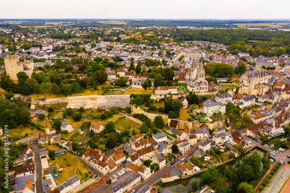 Scenic drone view of medieval fortified castle with royal residence and St Ours church in historic French town of Loches in summer..