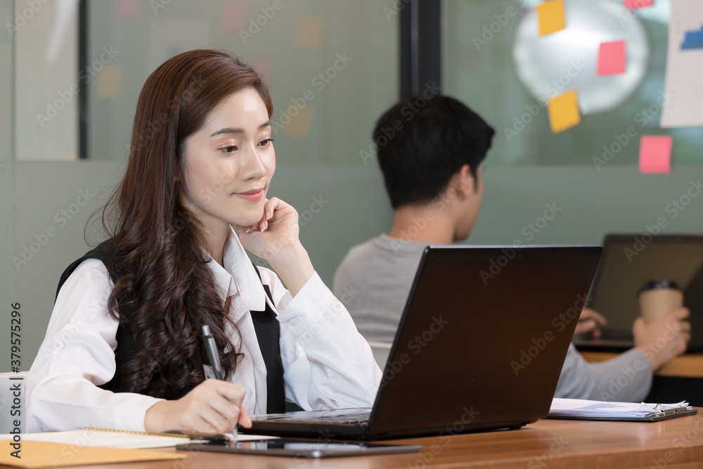 Business asian woman happy working job on laptop in office. Business asian woman happy working job on laptop in office.